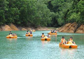People riding pedal boats in a lake Outdoor activities kids macau